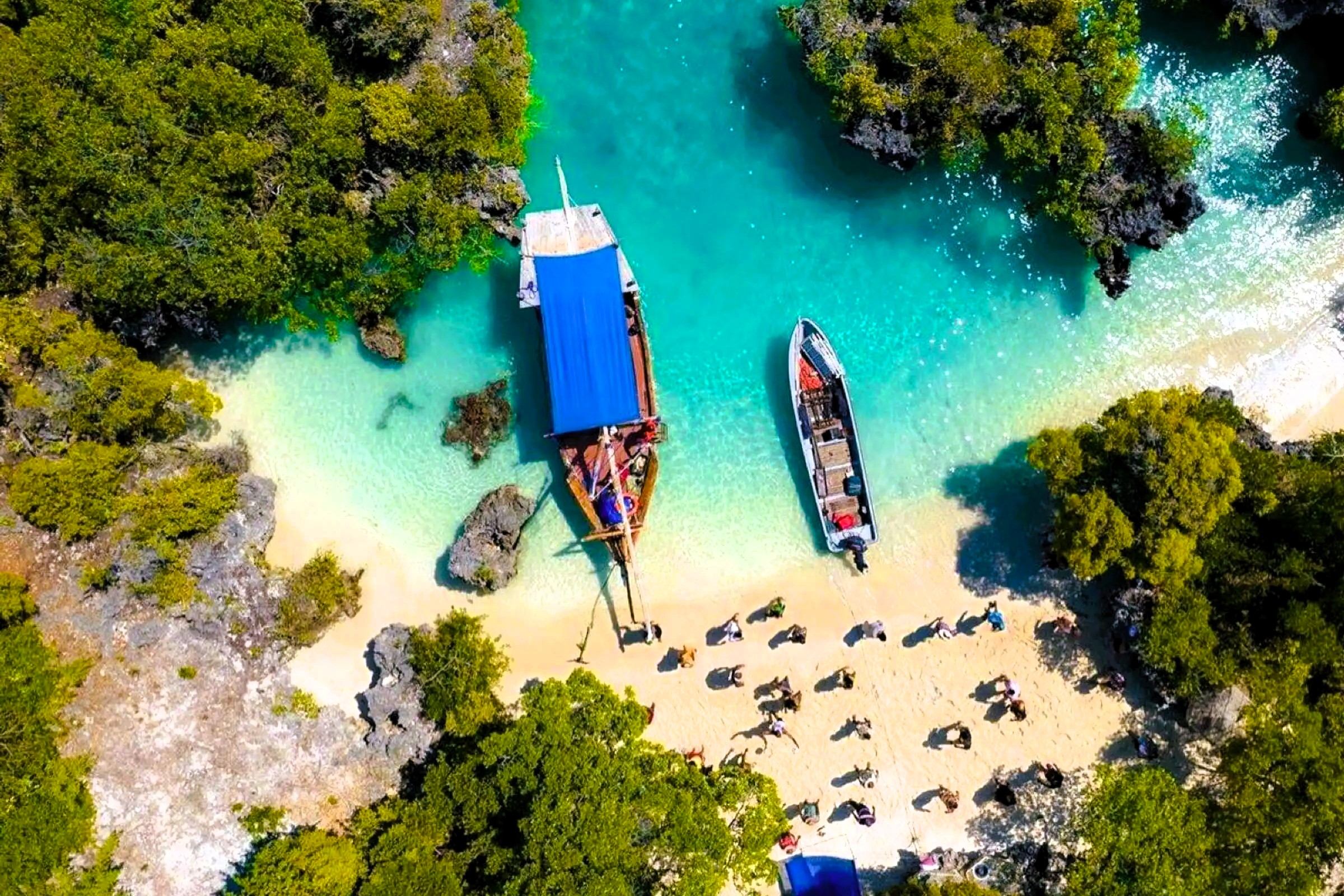 Aerial view of boats at a small beach cove